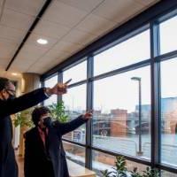 Cheryl Brown Henderson and Bobby Springer point out a window in the Eberhard Center